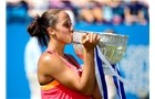 EASTBOURNE, ENGLAND - JUNE 21:  Madison Keys of the USA celebrates with the trophy after defeating Angelique Kerber of Germany in the Women's Final at the Aegon International at Devonshire Park on June 21, 2014 in Eastbourne, England.  (Photo by Ben Hoskins/Getty Images)